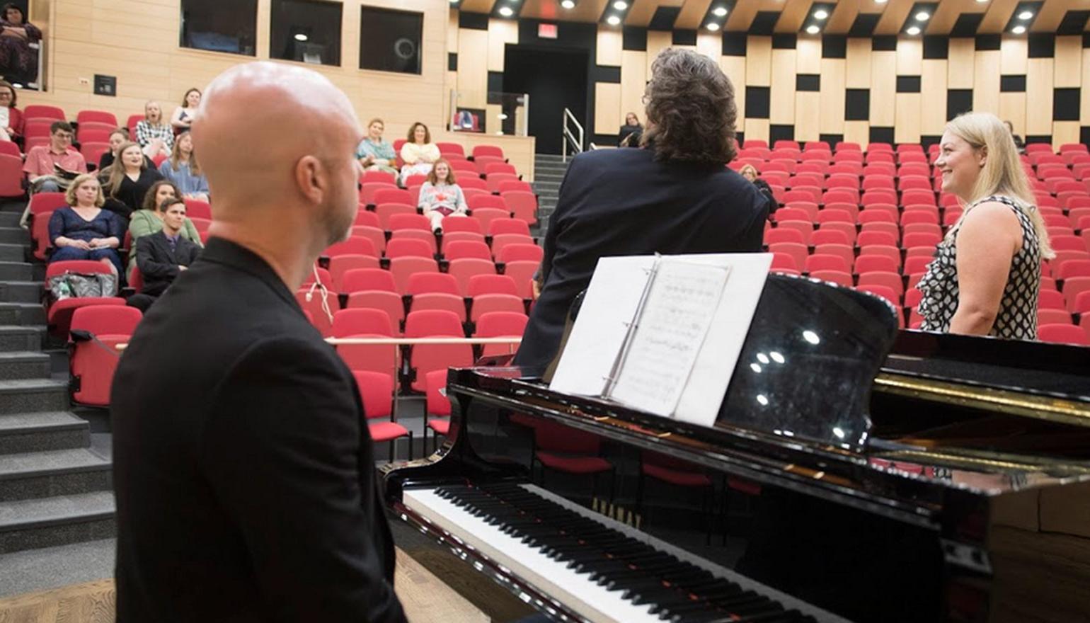 Students learning from opera singer